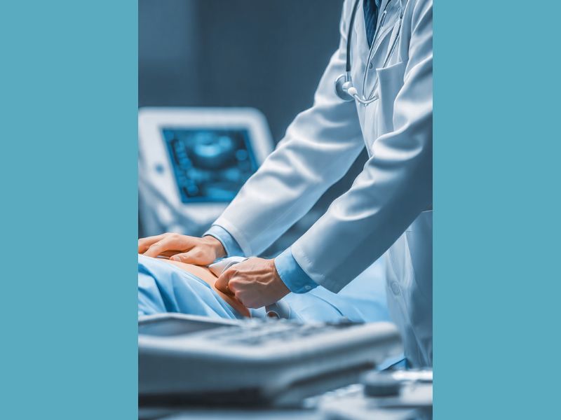 doctor doing abdominal ultrasound to diagnose gallbladder stones